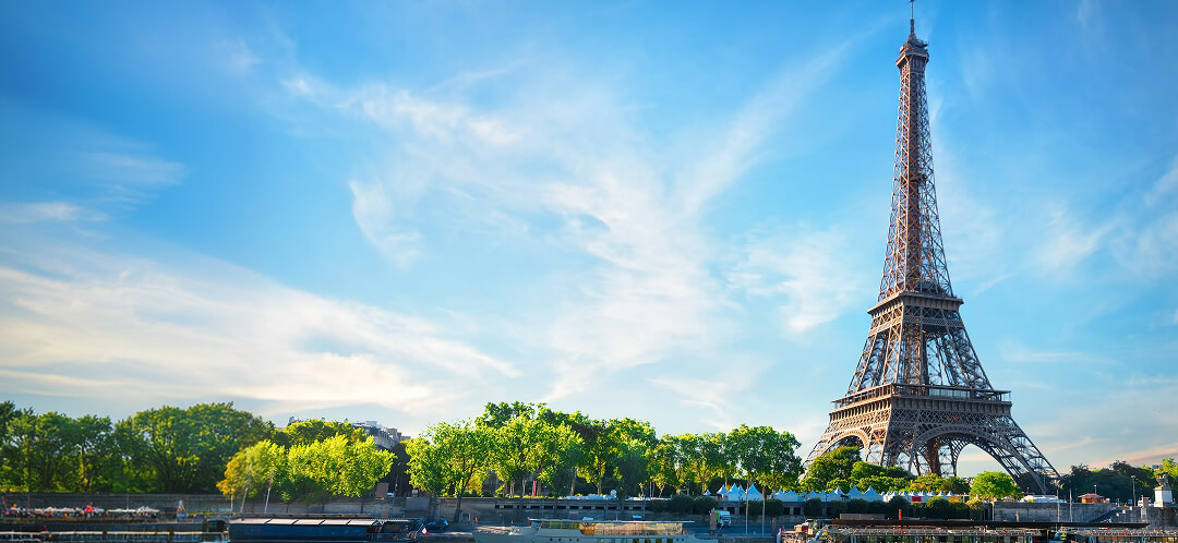 paris landmark eiffel tower green trees riverfront