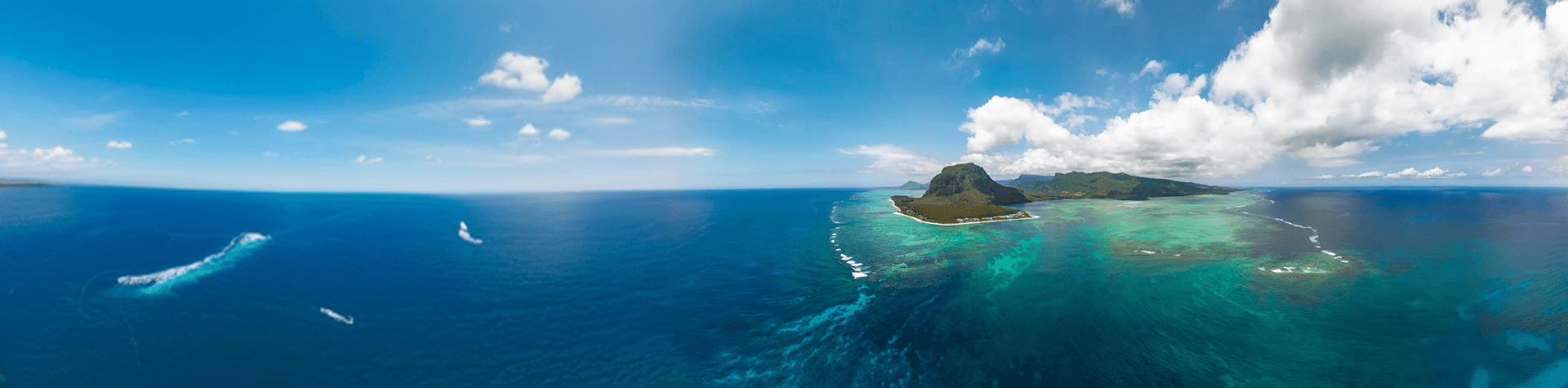 tropical island aerial view turquoise lagoon ocean reef panorama