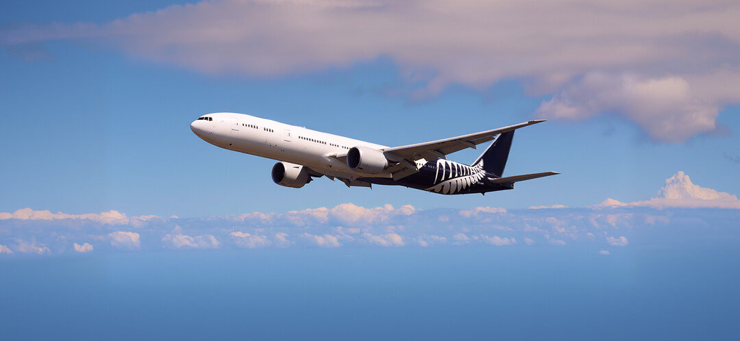 commercial airplane flying blue sky