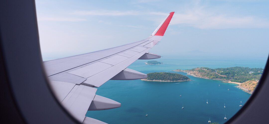 airplane window view on summer vacation flight