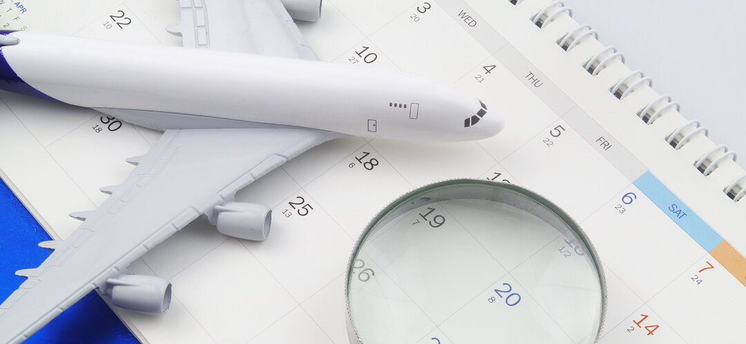 airplane model on travel planning calendar