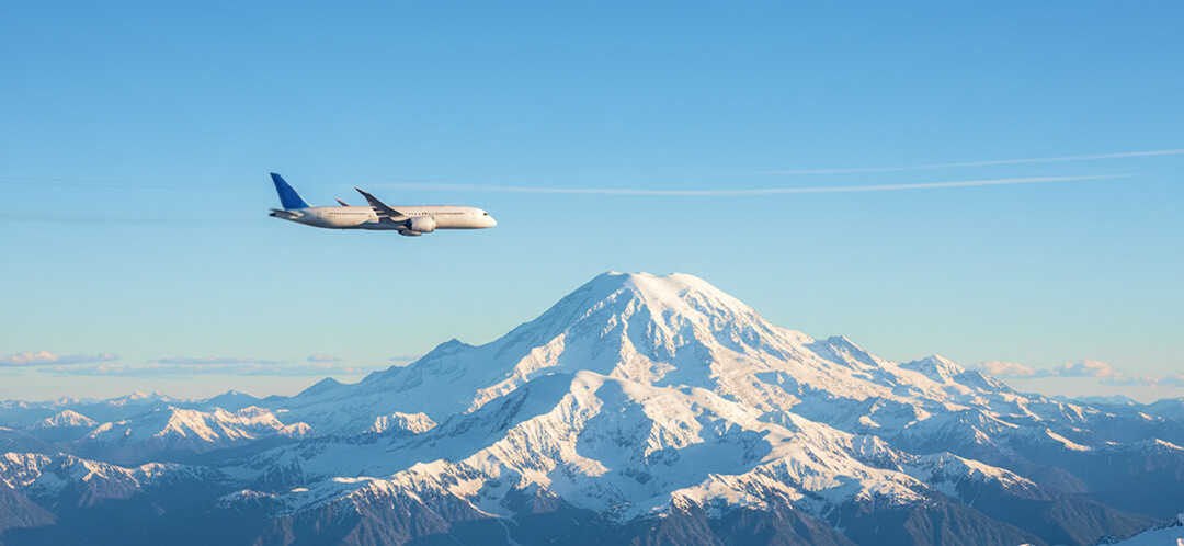 alaska airlines flight over alaska mountains