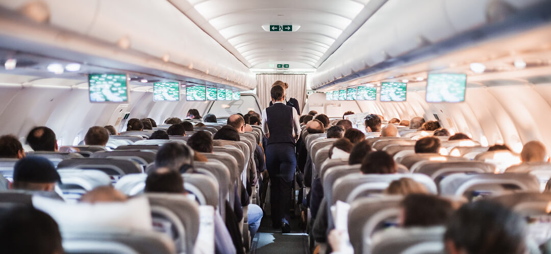 passengers inside commercial airplane cabin