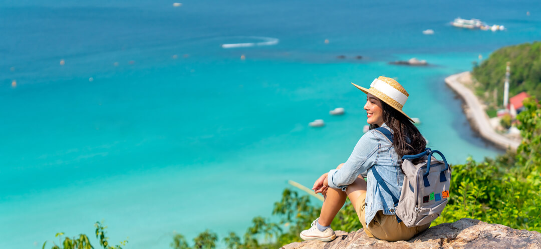 solo female traveler enjoying coastal view