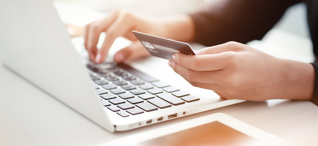 traveler booking flight online with credit card